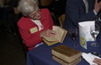 Dr Jacqueline de Haller perusing historical medical books 